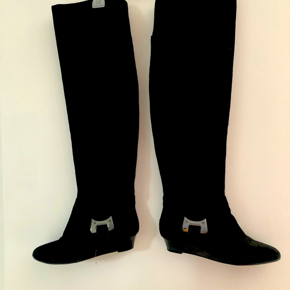 Black suede thigh boots.
